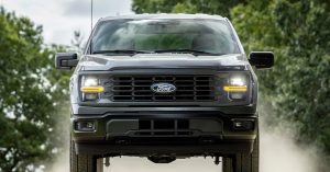 Front view of a Ford F-150 Hybrid, showcasing headlights, grille, and rugged design.