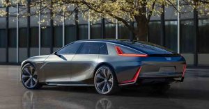 The Cadillac CELESTIQ is shown from a rear-side angle, featuring sleek lines, large wheels, and distinctive taillights.
