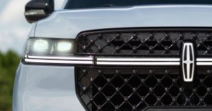 Front view of a Lincoln small electric crossover, featuring LED headlights and a distinctive grille.