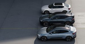 Three Polestar vehicles parked side by side in a well-lit outdoor setting.