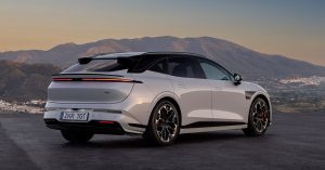 Rear angle of a white Zeekr 7GT Shooting Brake, showcasing sleek design and sporty wheels.