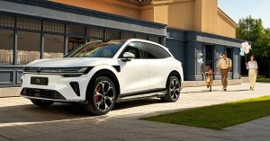 White Zeekr 7X parked in a sunny outdoor setting, showcasing sleek design and alloy wheels.