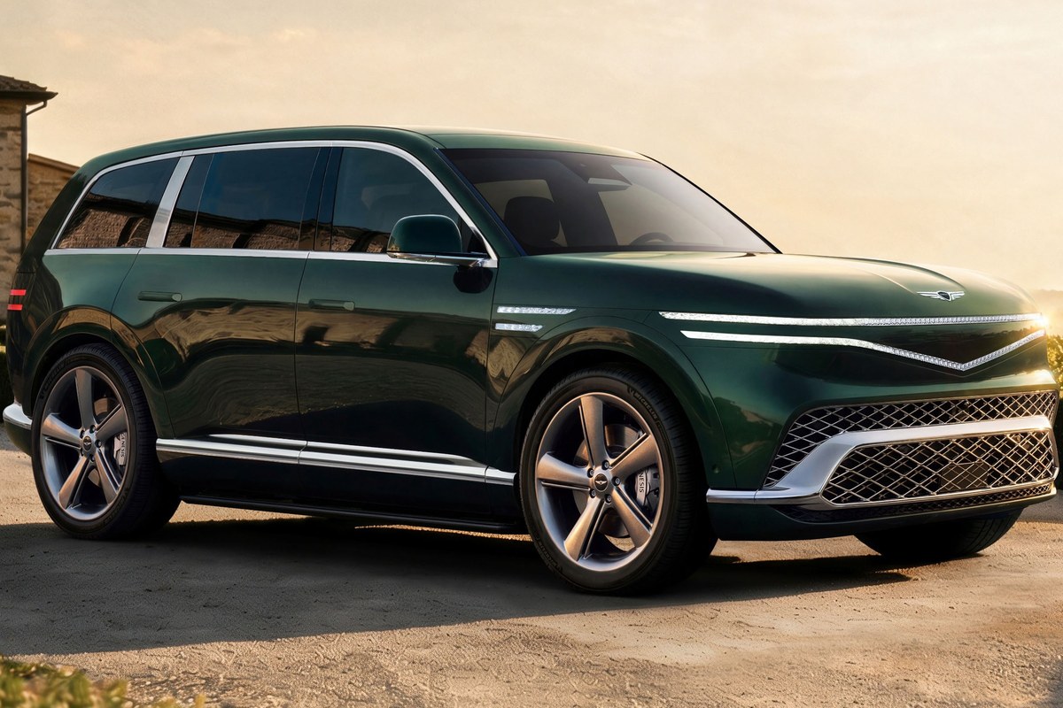 The image shows a green Genesis GV90 SUV from a front-side angle, featuring sleek lines and large alloy wheels.