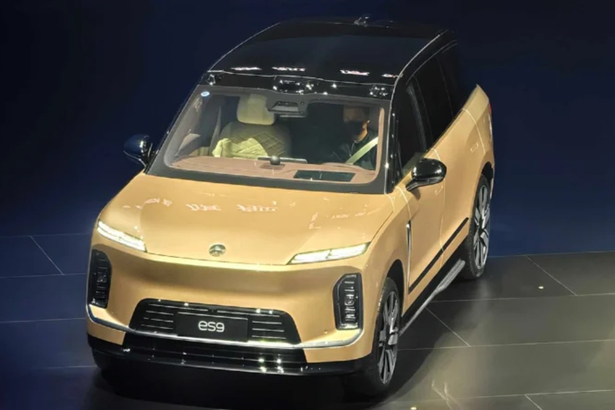 Front angle view of Nio ES9 in a showroom, featuring sleek design and large wheels.