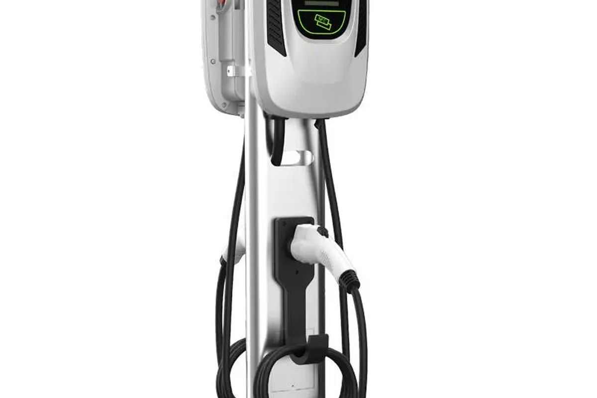 Schneider Charge Home EV Charger with a charging port and cables, mounted on a wall.
