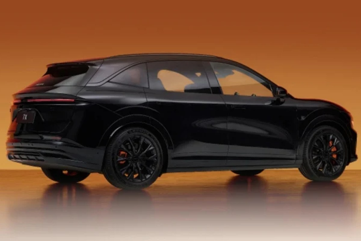 Black electric SUV shown from the side, featuring black wheels and sleek design.