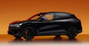 Side view of a black electric SUV with black wheels and orange brake calipers.