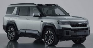 Silver SUV with angular design, prominent grille, large wheels, and no visible charging port.